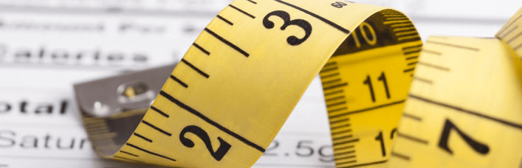 measuring tape on top of nutrition information sheet