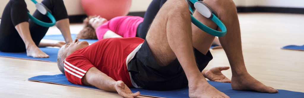 Pilates students using Pilates ring