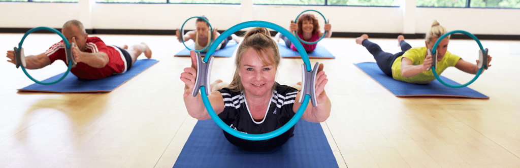 Pilates group class using Pilates rings