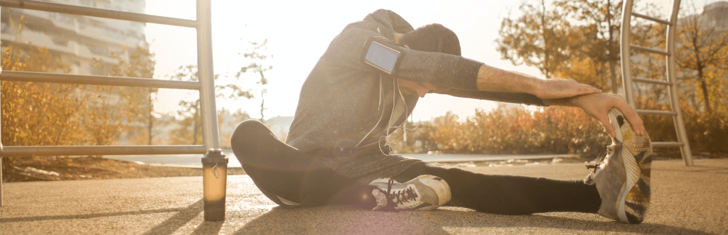 Runner taking a rest and stretching