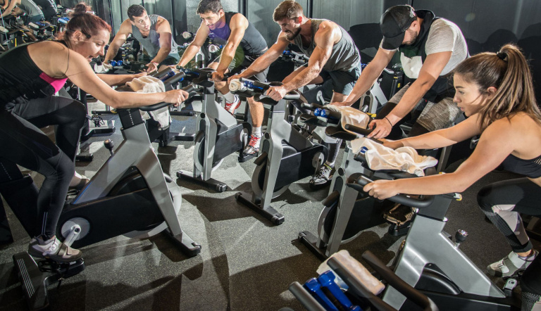 Group cycling class with instructor