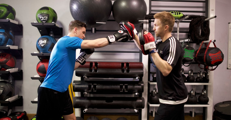 Personal Trainer and client boxing