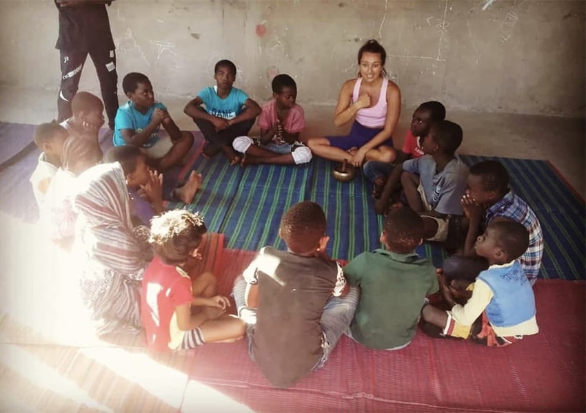 Zoe teaching a group of children