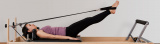 A student performing Reformer Pilates