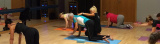 Pilates teacher guiding her client