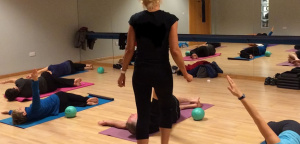 Ruth Hoyle leading a Pilates class