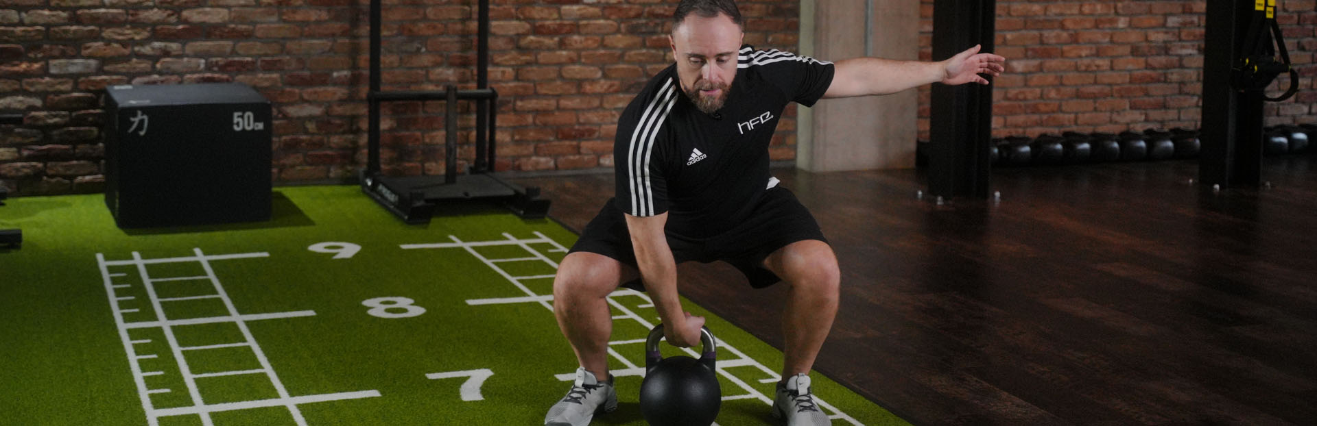 HFE tutor teaching kettlebell training