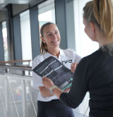 Nutrition coach discussing protein powder with client