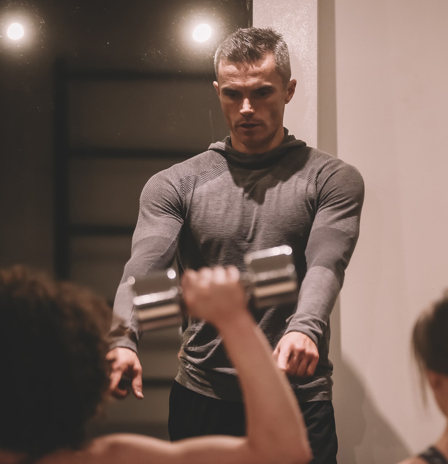 Matt Roberts training a client in the gym 