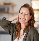 female of menopausal years with hands in air