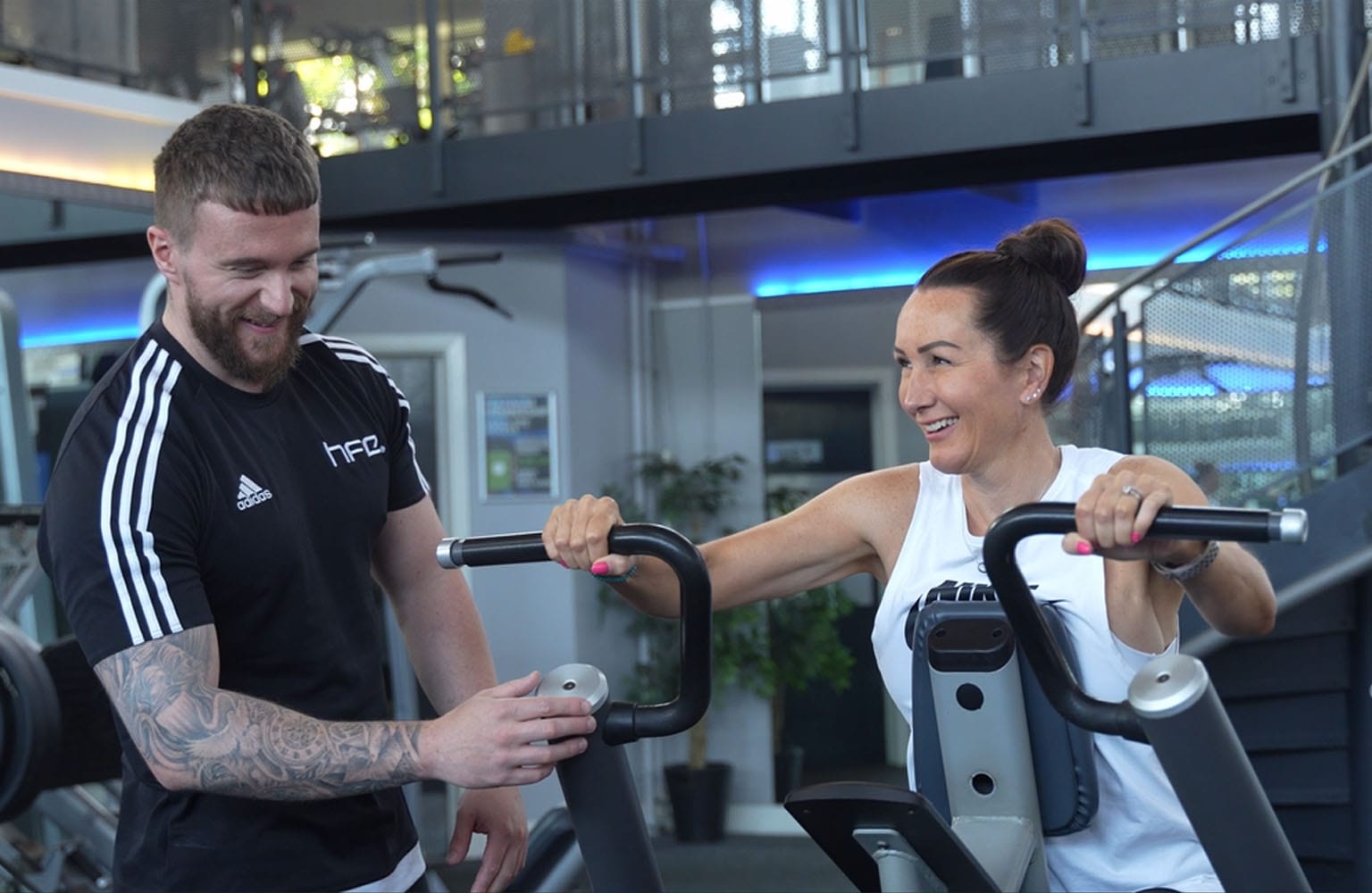 female client on row machine