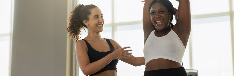Health coach with overweight woman in the gym Health coach with overweight woman in the gym