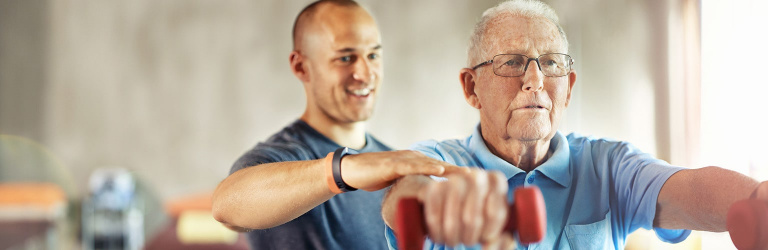 Exercise referral instructor with older client Exercise referral instructor with older client
