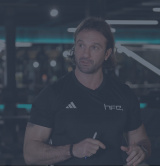 Personal trainer, Luke Worthington, dressed in a HFE t-shirt in the gym