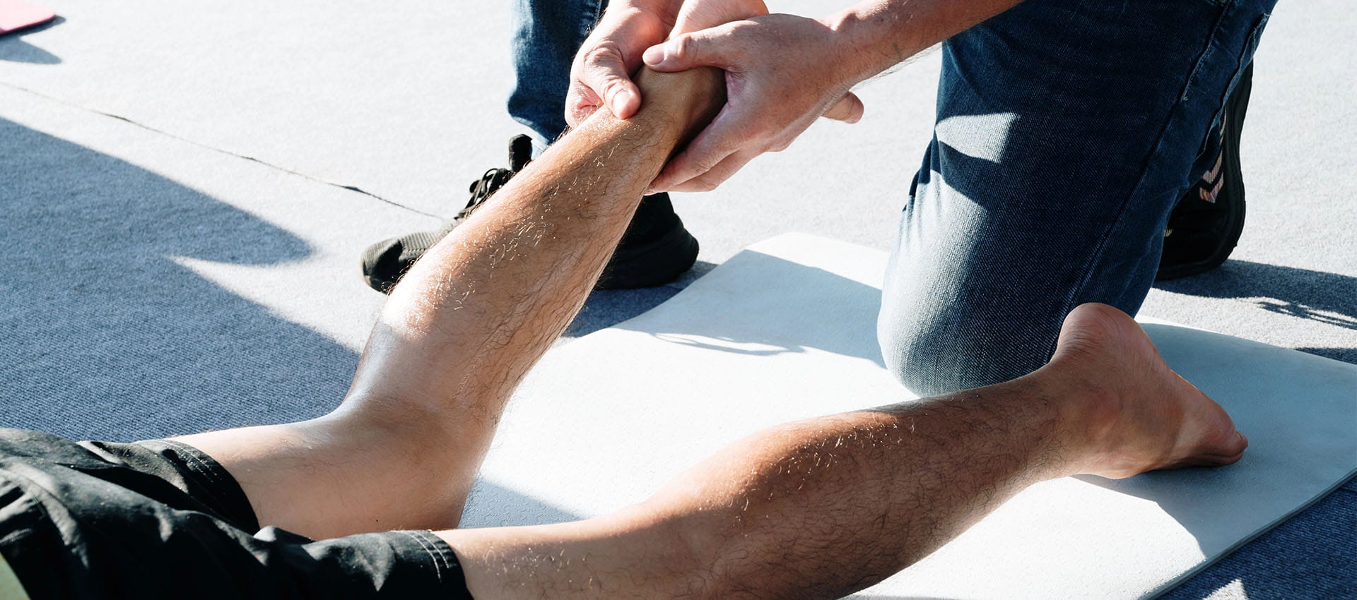 sports massage therapist massaging a runner