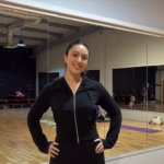 Alex Tambaro in a studio smiling at the camera