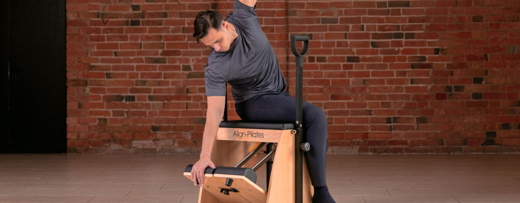 Classical Pilates chair - man on apparatus Classical Pilates chair - man on apparatus