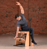 Classical Pilates chair - man on apparatus Classical Pilates chair - man on apparatus