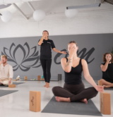 HFE Students practicing Iyengar yoga with a tutor