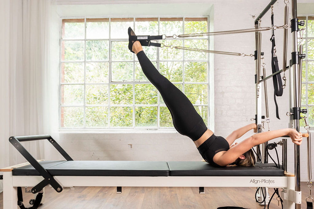 HFE student using the Pilates tower