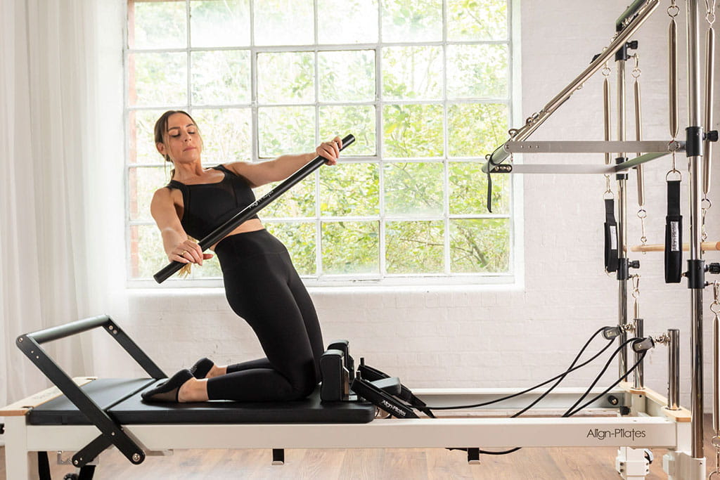 HFE student using the Pilates tower